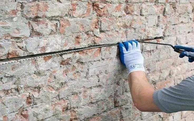 Stitching cracked brick walls